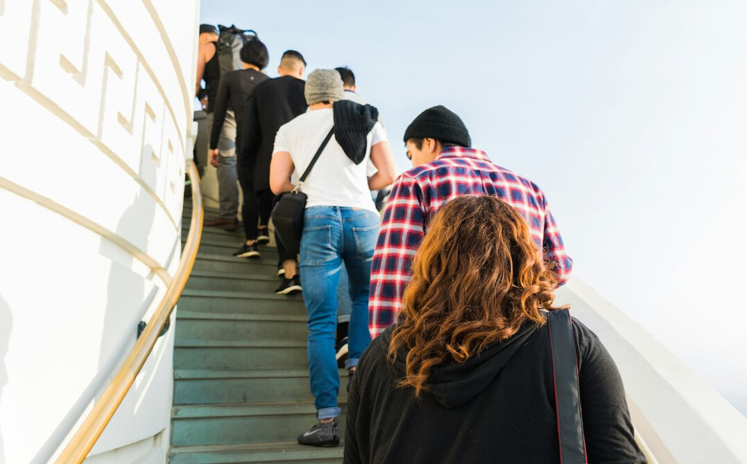 Passengers queueing to board a harbor ferry