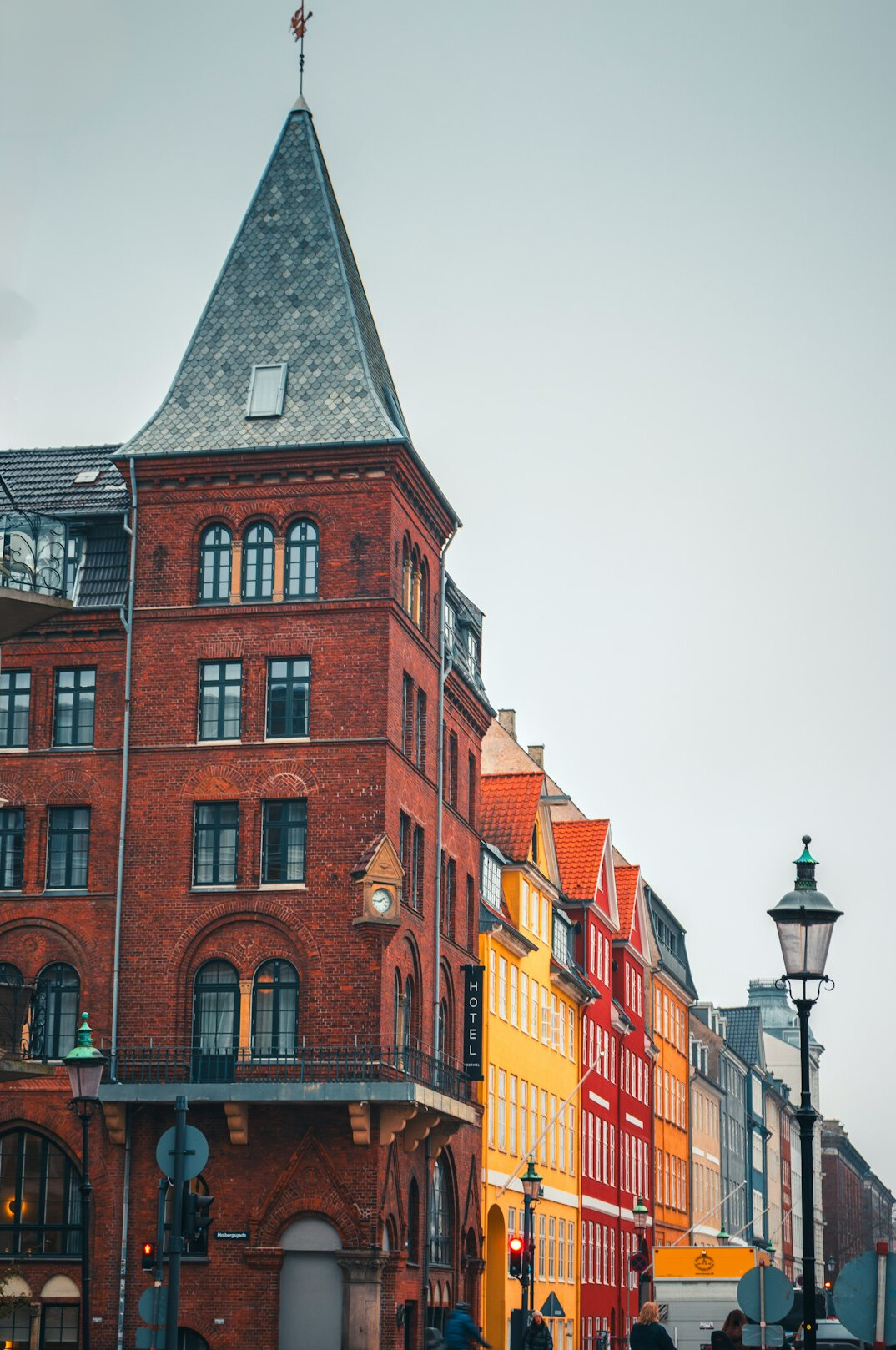 Small group following a guide through a cobblestone street in Copenhagen
